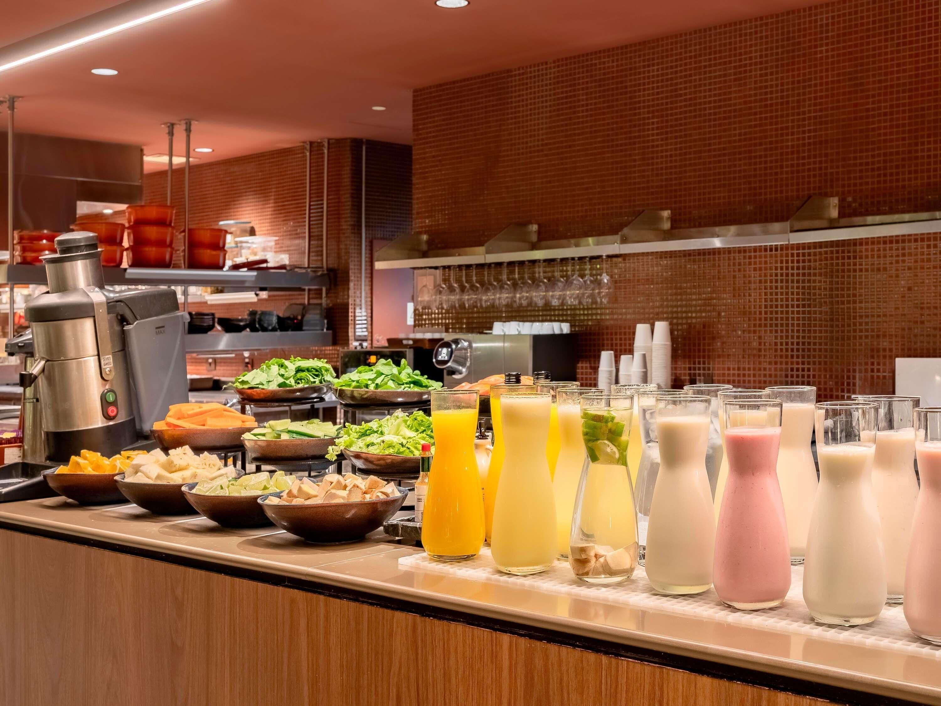 A buffet with various food items and beverages.