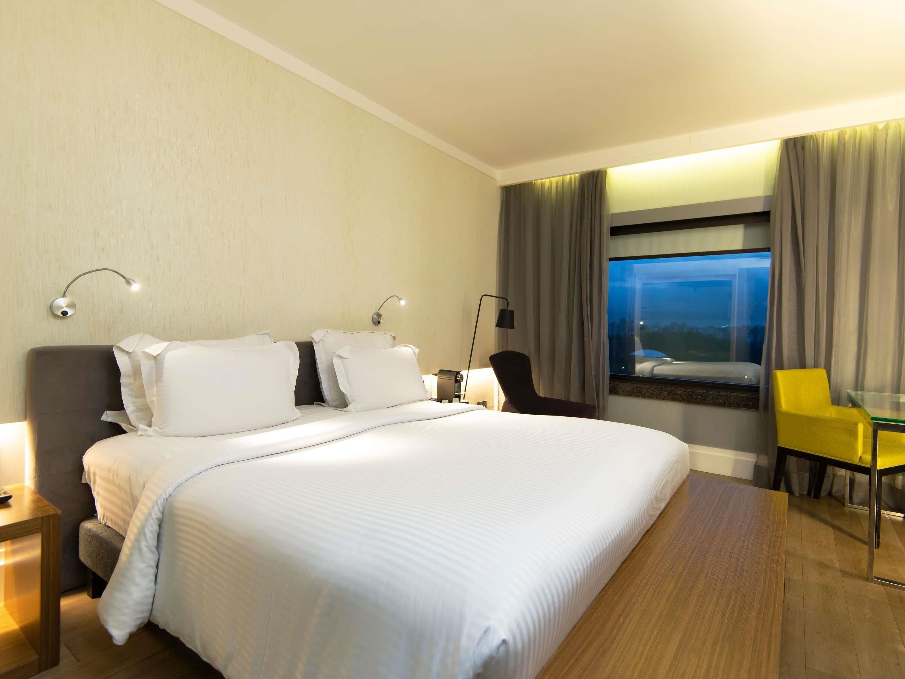 Habitación ejecutiva, 1 cama Queen size | Ropa de cama de alta calidad y minibar 