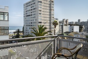 Room, 1 King Bed, Partial Sea View (Balcony) | 1 bedroom, in-room safe, desk, laptop workspace