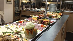 A buffet with various food items including meats, cheeses, and fruits. -  Hotel Ritter Badenweiler (Badenweiler)