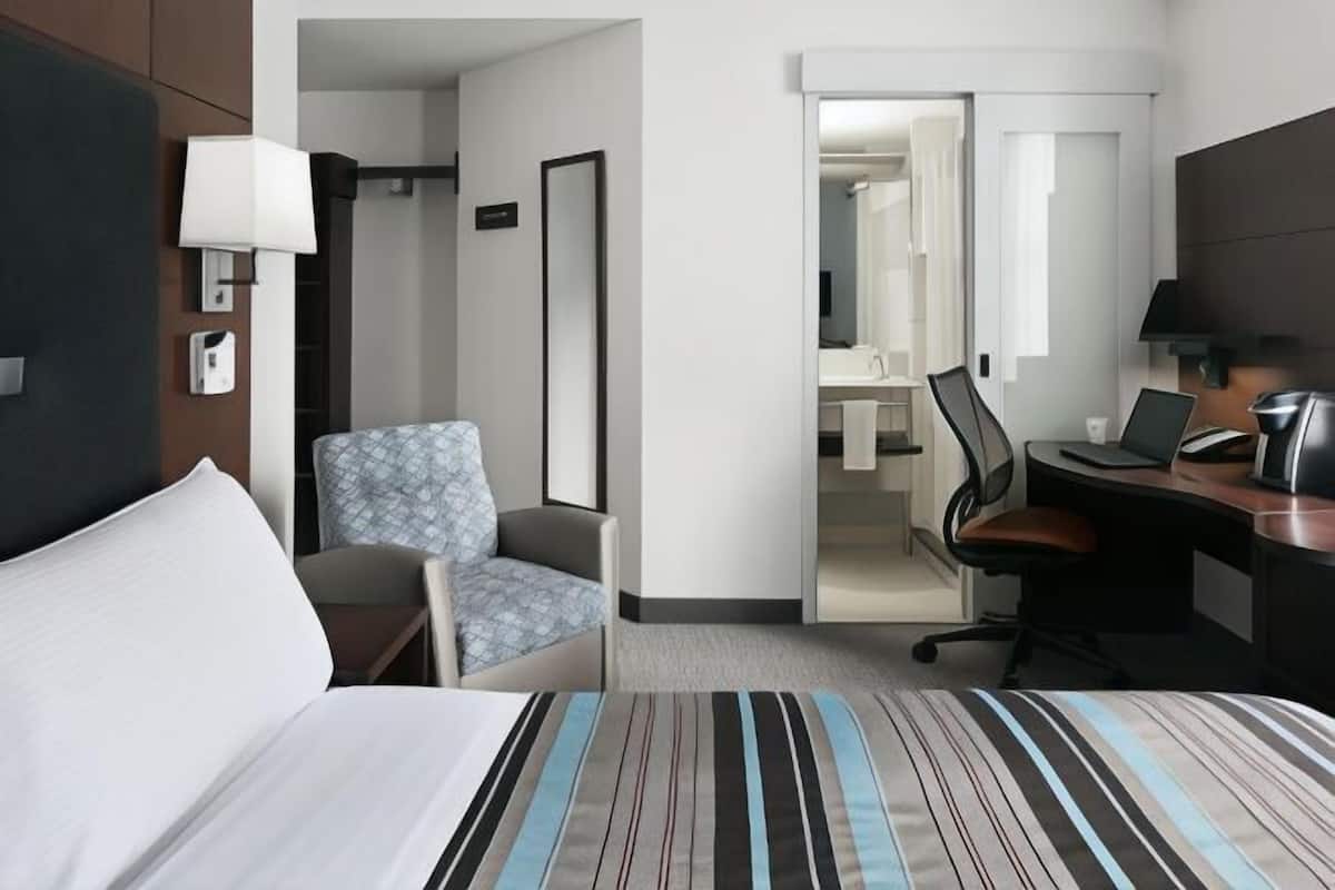 Premium bedding, desk, laptop workspace, free WiFi