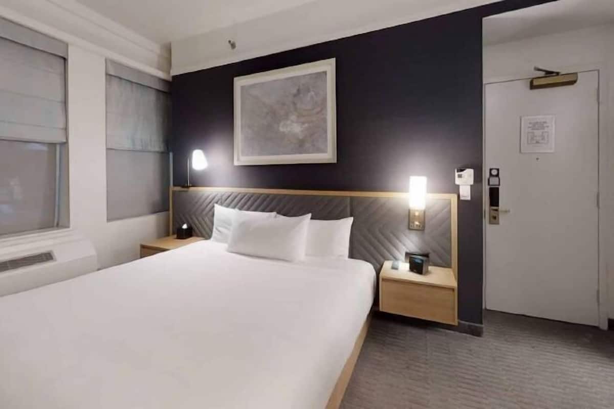 Premium bedding, desk, laptop workspace, free WiFi