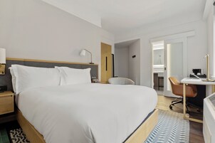 Premium bedding, desk, laptop workspace, free WiFi