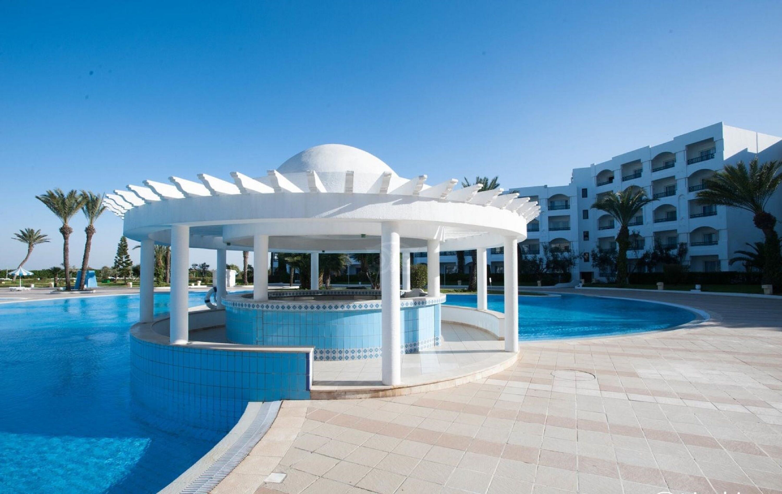 indoor pool, outdoor pool, pool umbrellas, pool loungers