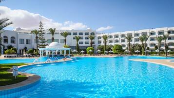 Indoor pool, outdoor pool, pool umbrellas, pool loungers