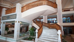 A grand interior with a marble staircase, multiple levels, and ornate railings. - Mahdia Palace Thalasso (Mahdia)