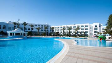 Indoor pool, outdoor pool, pool umbrellas, pool loungers