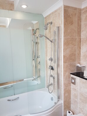 Designer toiletries, hair dryer, towels