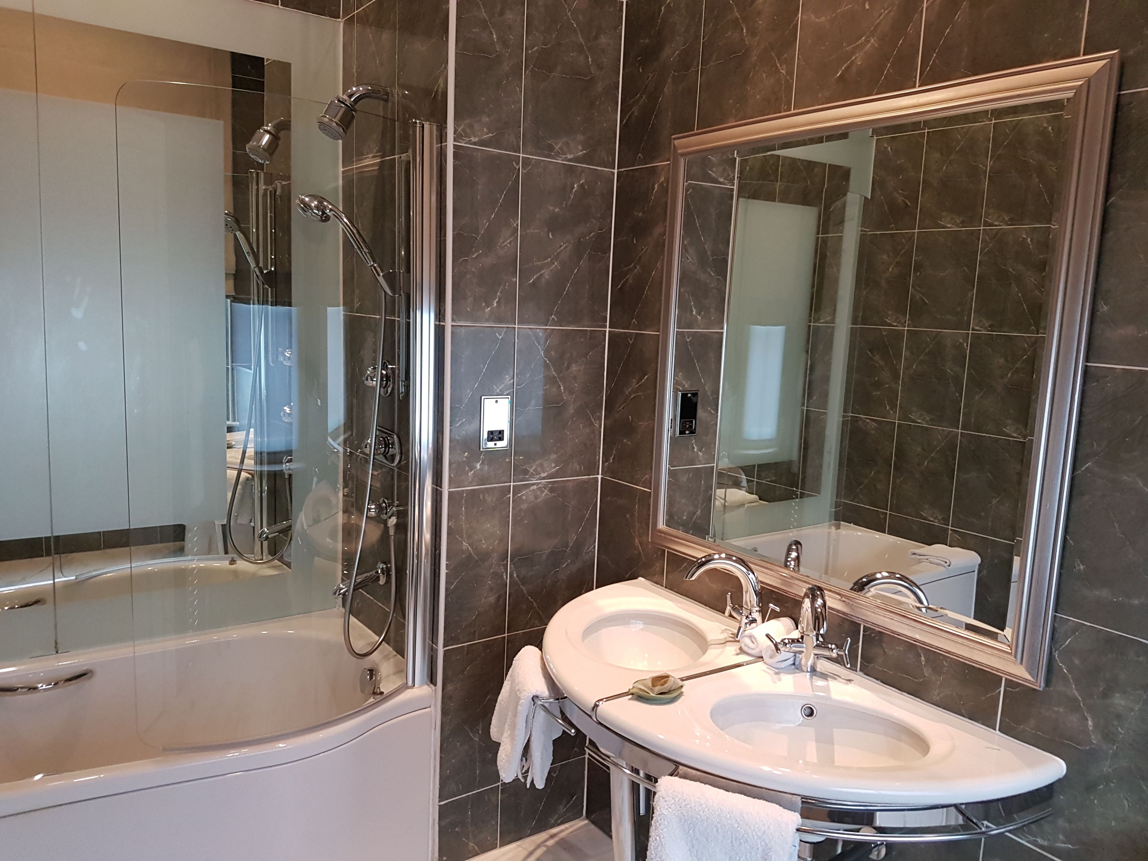 designer toiletries, hair dryer, towels