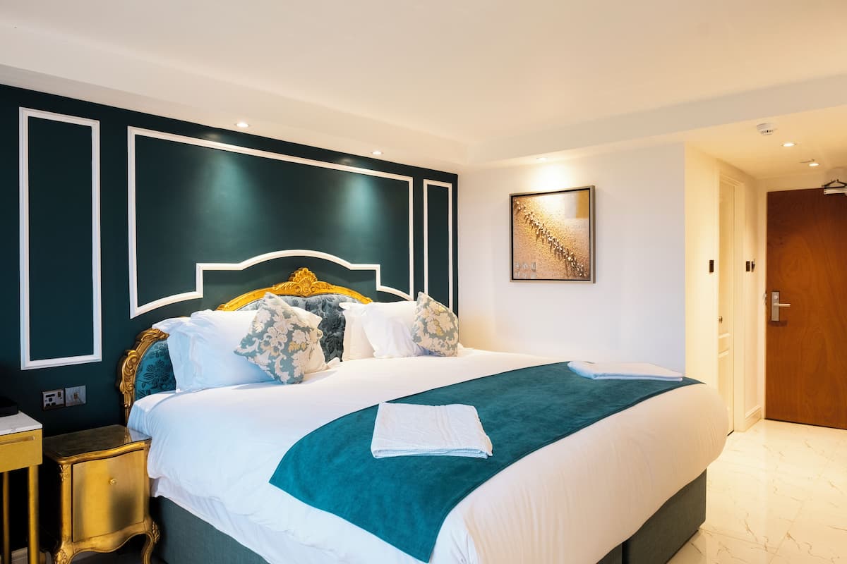 Executive Double Room | Desk, blackout drapes, iron/ironing board