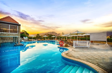 2 outdoor pools, open 8:00 AM to 8:00 PM, pool umbrellas, sun loungers
