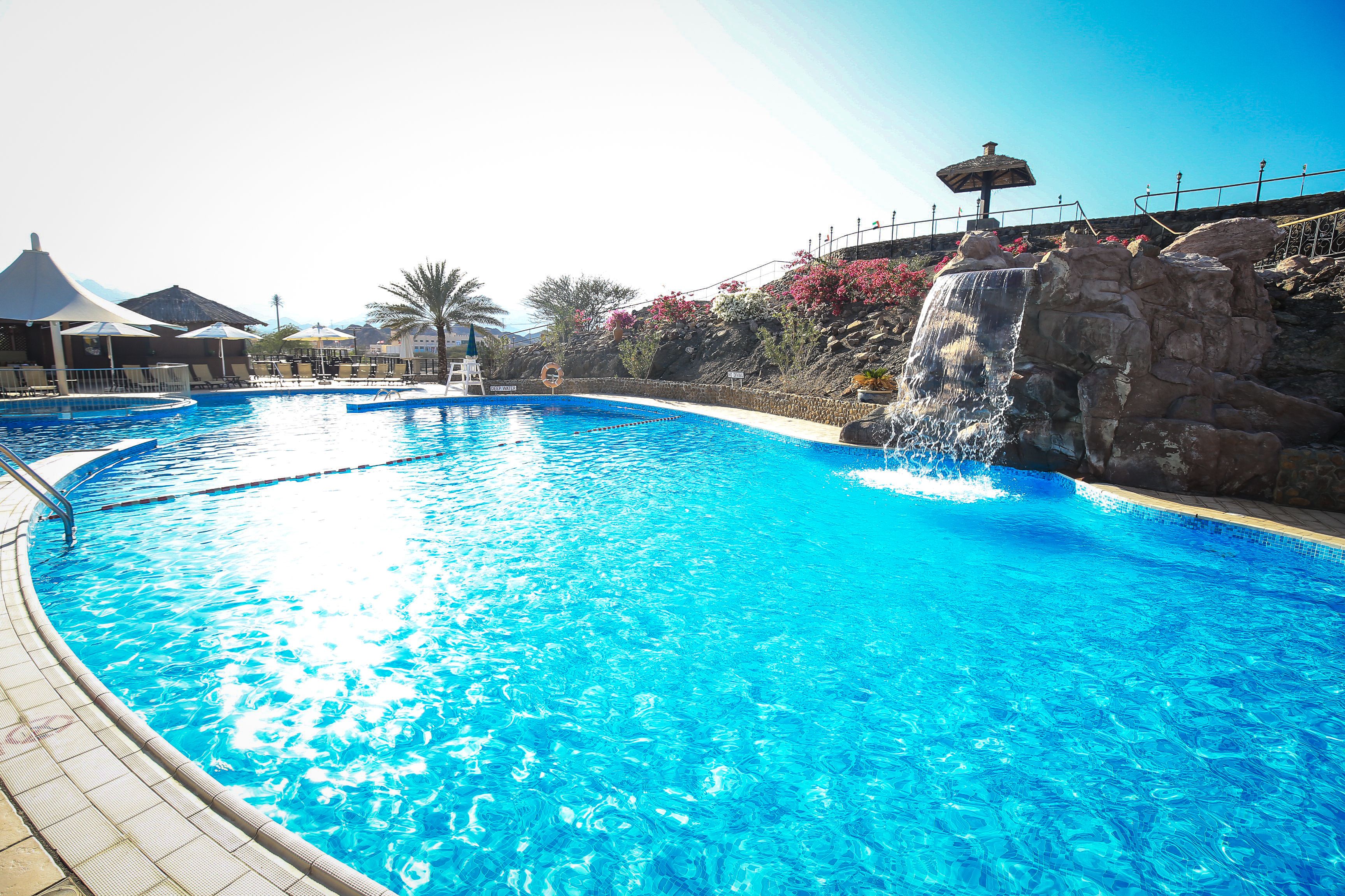 2 outdoor pools, open 8:00 AM to 8:00 PM, pool umbrellas, pool loungers