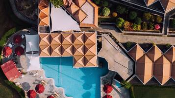 2 outdoor pools, open 8:00 AM to 8:00 PM, pool umbrellas, pool loungers