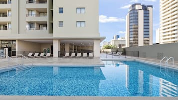 Outdoor pool, open 8:00 AM to 10:00 PM, pool loungers
