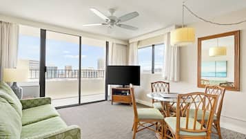 Room, 1 Queen Bed with Sofa bed, Corner | Living area | 37-inch TV with cable channels, DVD player