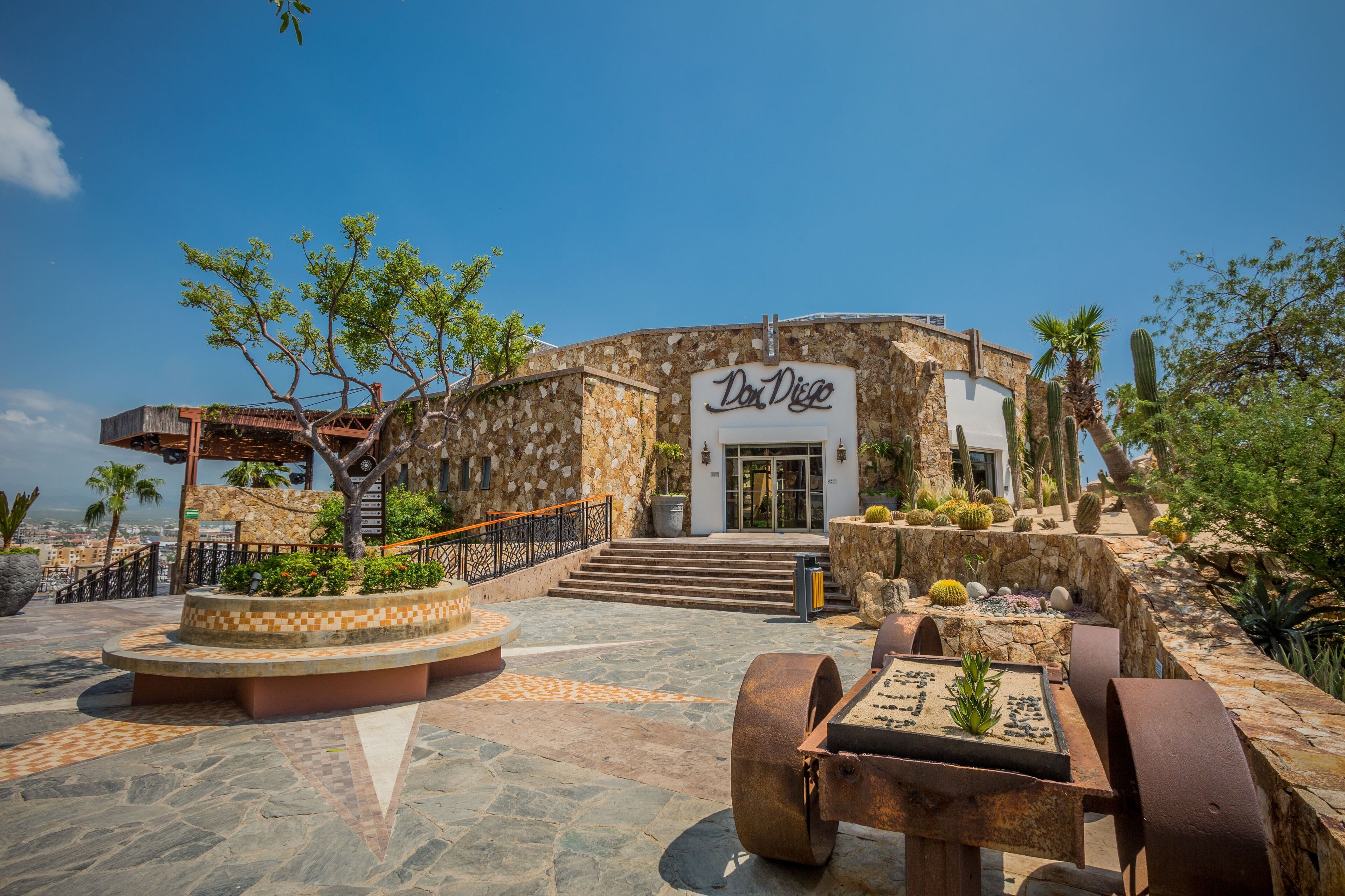 A building with a stone facade and a sign reading "Don Diego."