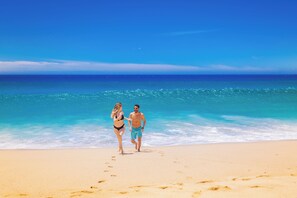 On the beach, sun loungers, beach umbrellas, beach towels