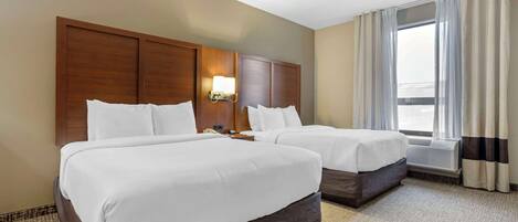 Pillow-top beds, desk, blackout curtains, iron/ironing board