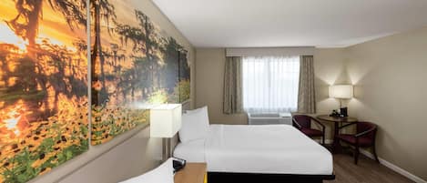 A hotel room with two beds, a desk with a lamp, a chair, a large painting on the wall, and a window with curtains.