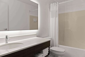 A modern bathroom with a large mirror, a sink, a toilet, and a shower area. - Days Inn by Wyndham Steinbach (Steinbach)