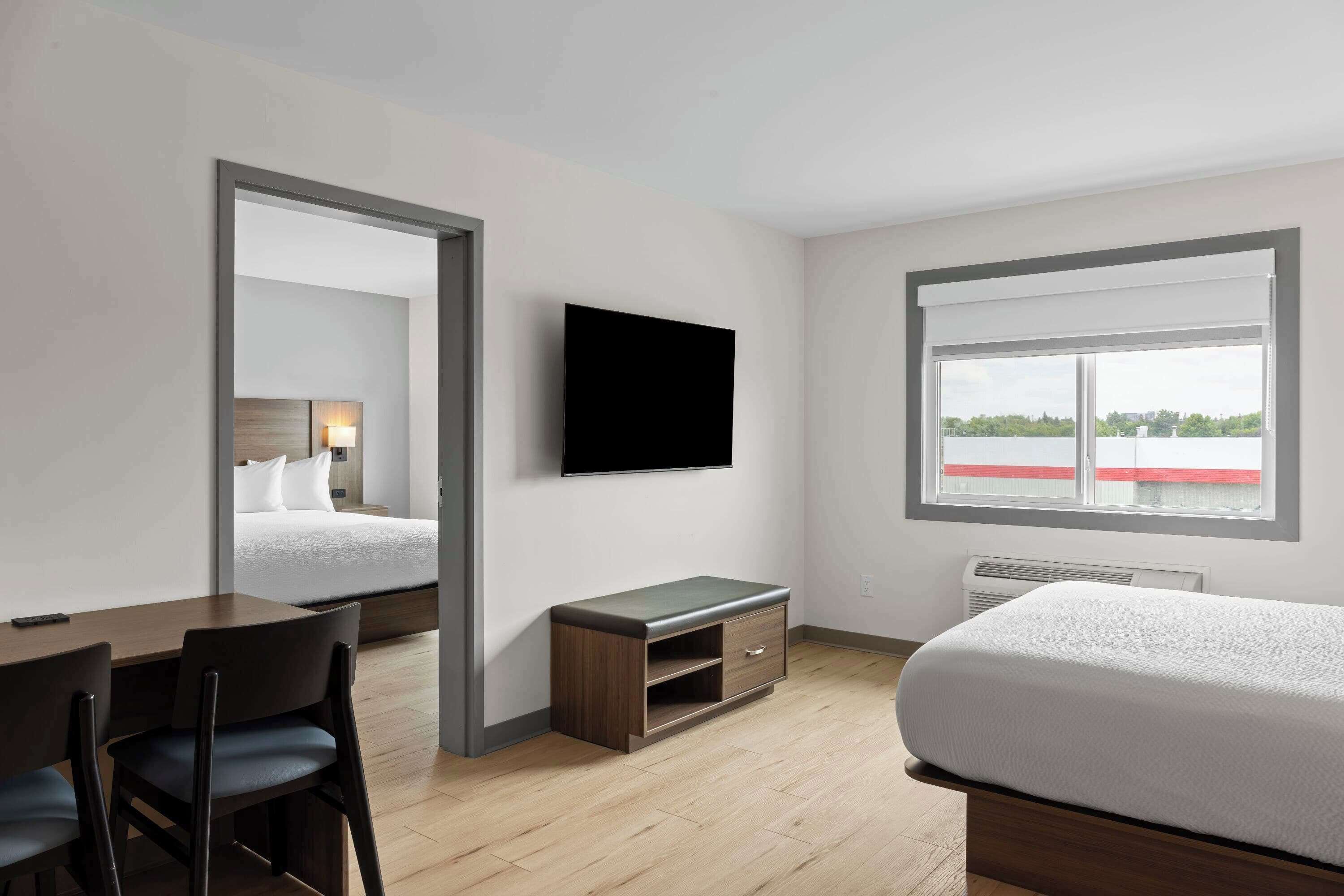 1 King Bed, 1 Queen Bed, 1-Bedroom Suite, Kitchenette, Non-Smoking | Pillowtop beds, individually decorated, individually furnished, desk