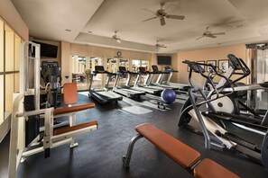 A gym with treadmills, elliptical machines, and weight equipment. - Tempe Mission Palms, a Destination by Hyatt Hotel (Tempe)