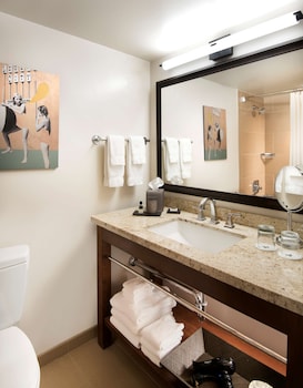 Combined shower/tub, designer toiletries, hair dryer, bathrobes at Tempe Mission Palms, a Destination by Hyatt Hotel