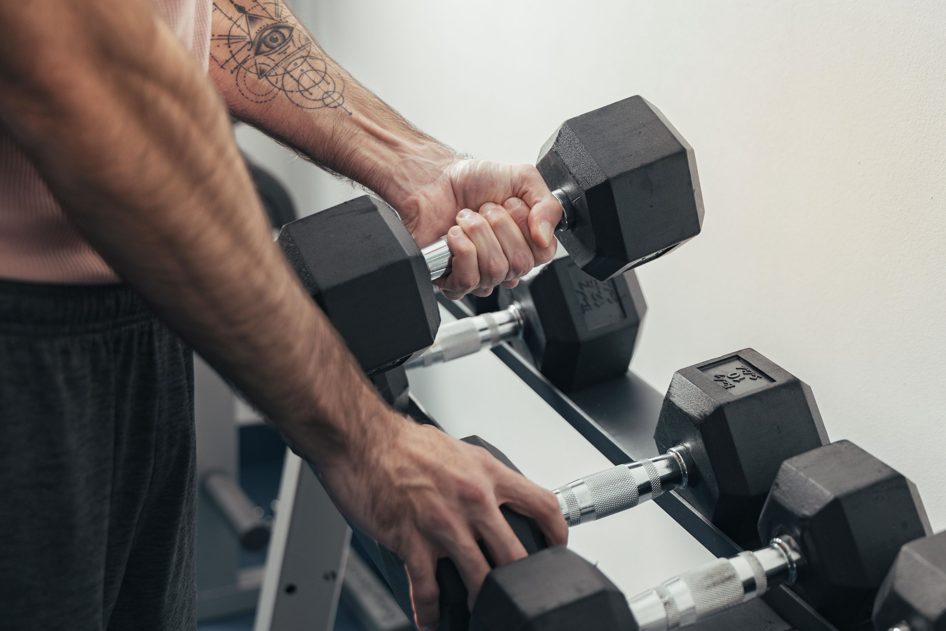 A person lifting a dumbbell.
