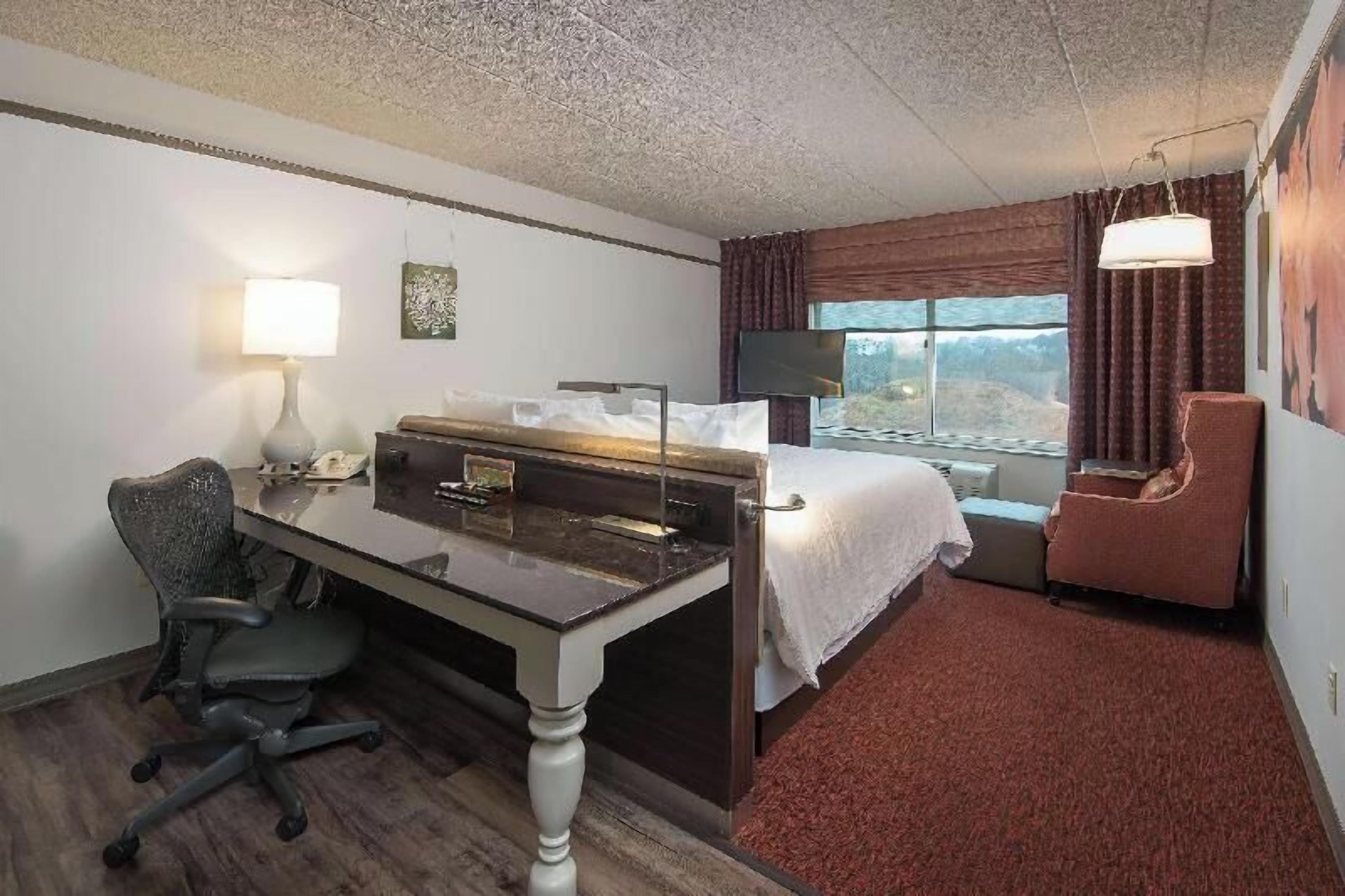 Desk, laptop workspace, blackout curtains, iron/ironing board