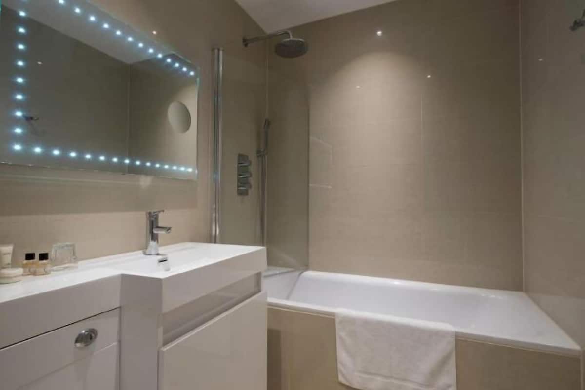 Bathroom | Shower, rainfall showerhead, eco-friendly toiletries, hair dryer