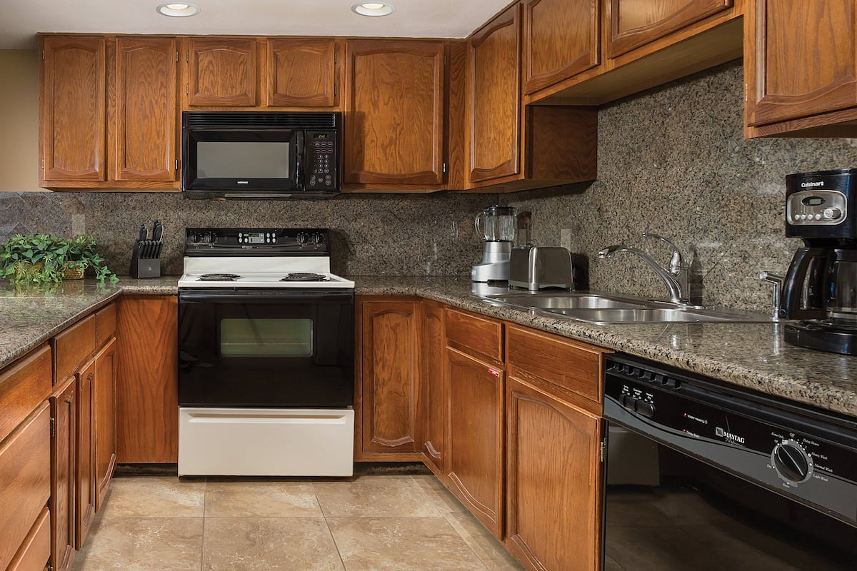 full-sized fridge, microwave, stovetop, coffee/tea maker