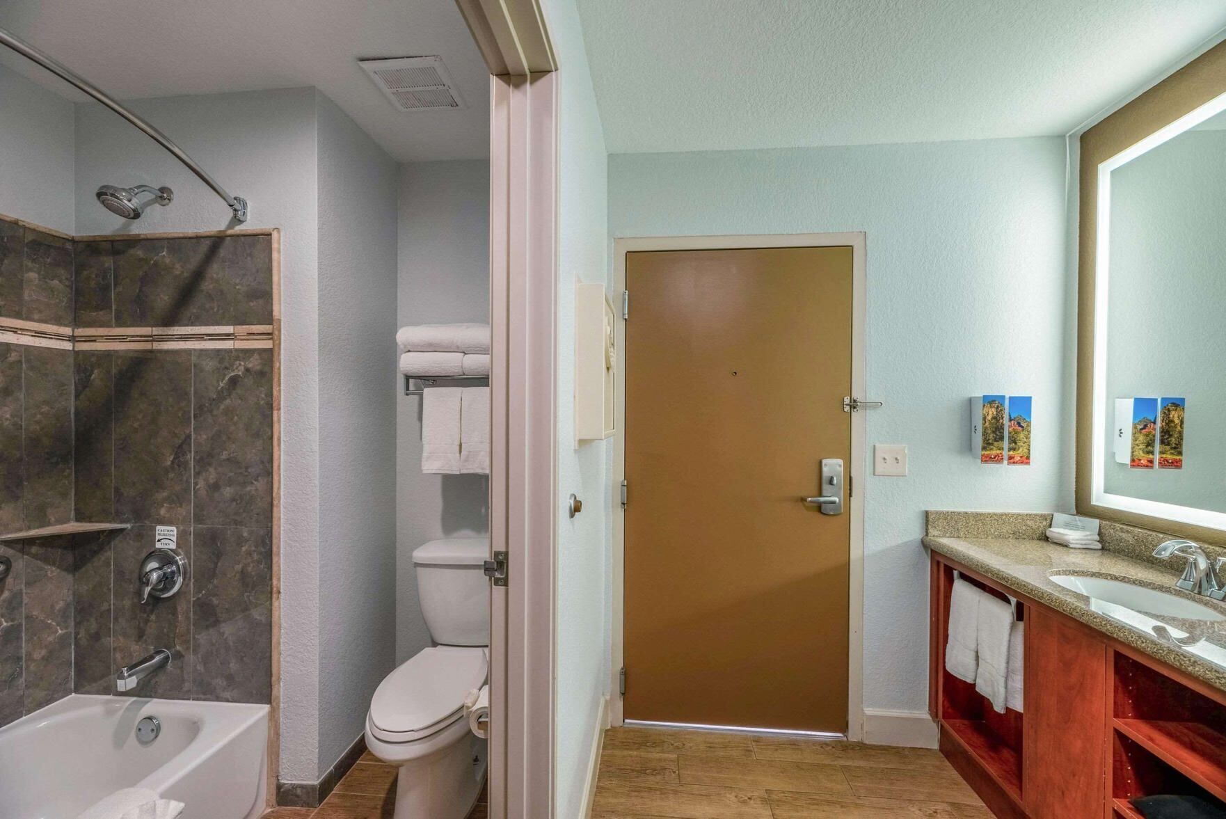 Bathroom | Combined shower/tub, eco-friendly toiletries, hair dryer, slippers