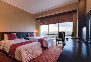 Habitación Deluxe | Escritorio, camas extra y wifi gratis 