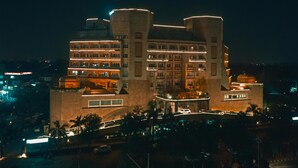 A multi-story hotel with a central courtyard, multiple balconies, and a prominent dome structure. - Park Plaza Ludhiana (Ludhiana)