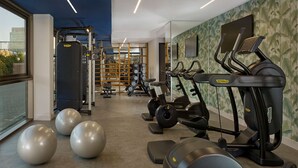 A modern gym with cardio equipment, weight machines, and exercise balls. - Park Plaza Utrecht (Utrecht)