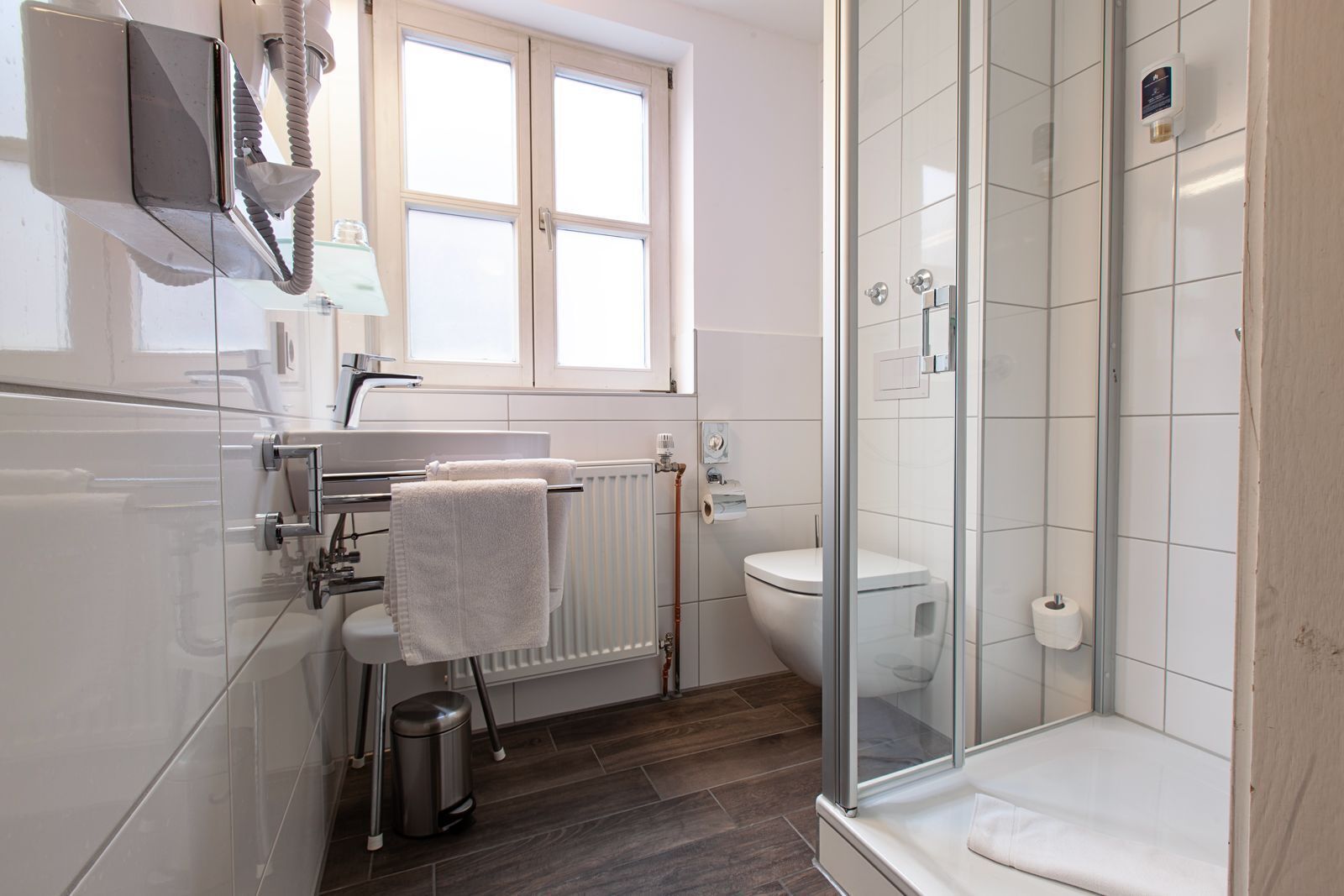 hair dryer, towels, soap, shampoo