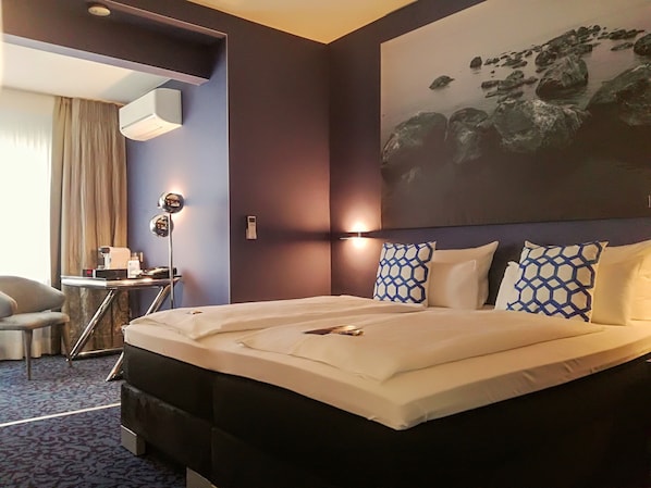 Junior Suite | Pillowtop beds, in-room safe, individually furnished, desk