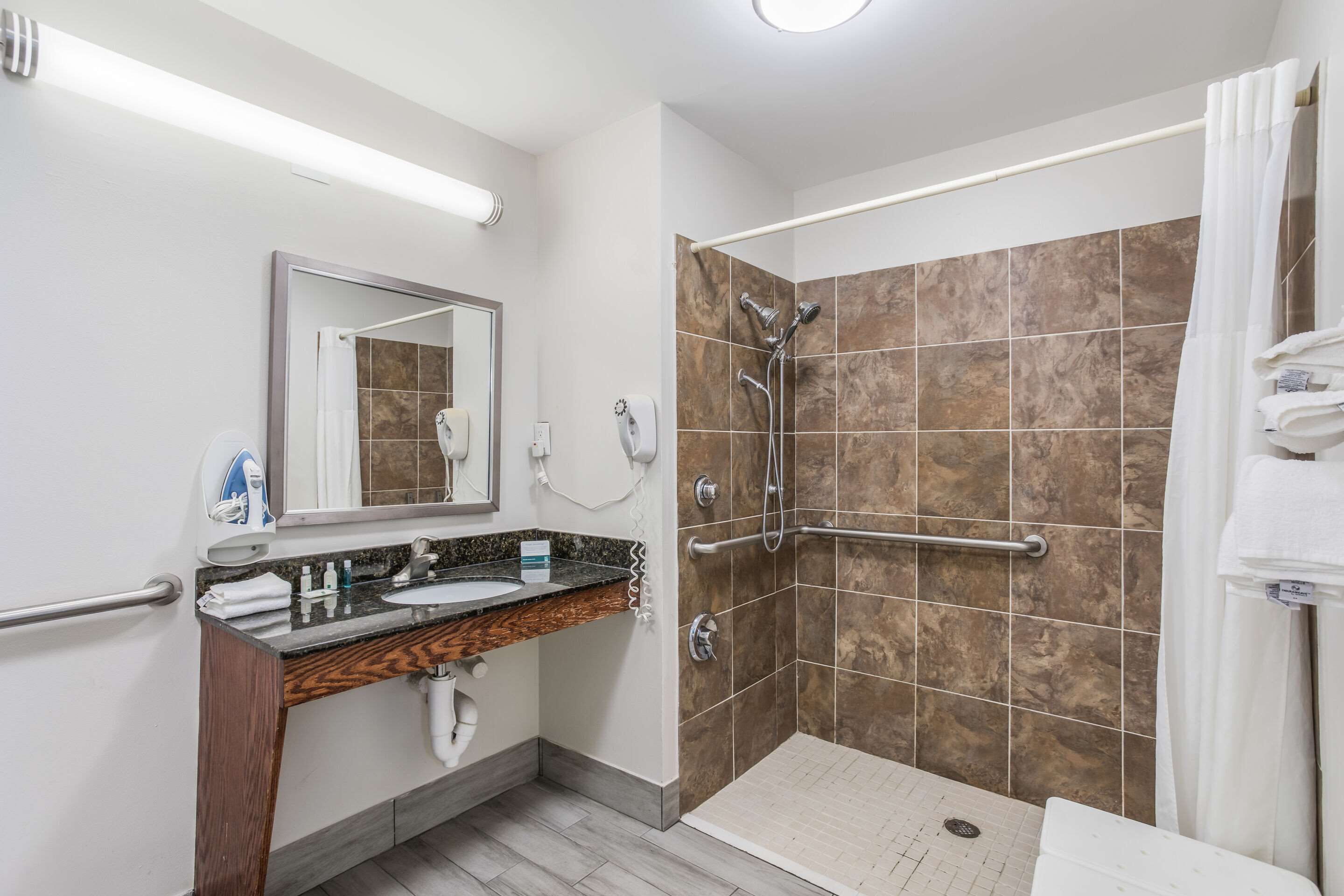 desk, laptop workspace, blackout curtains, iron/ironing board