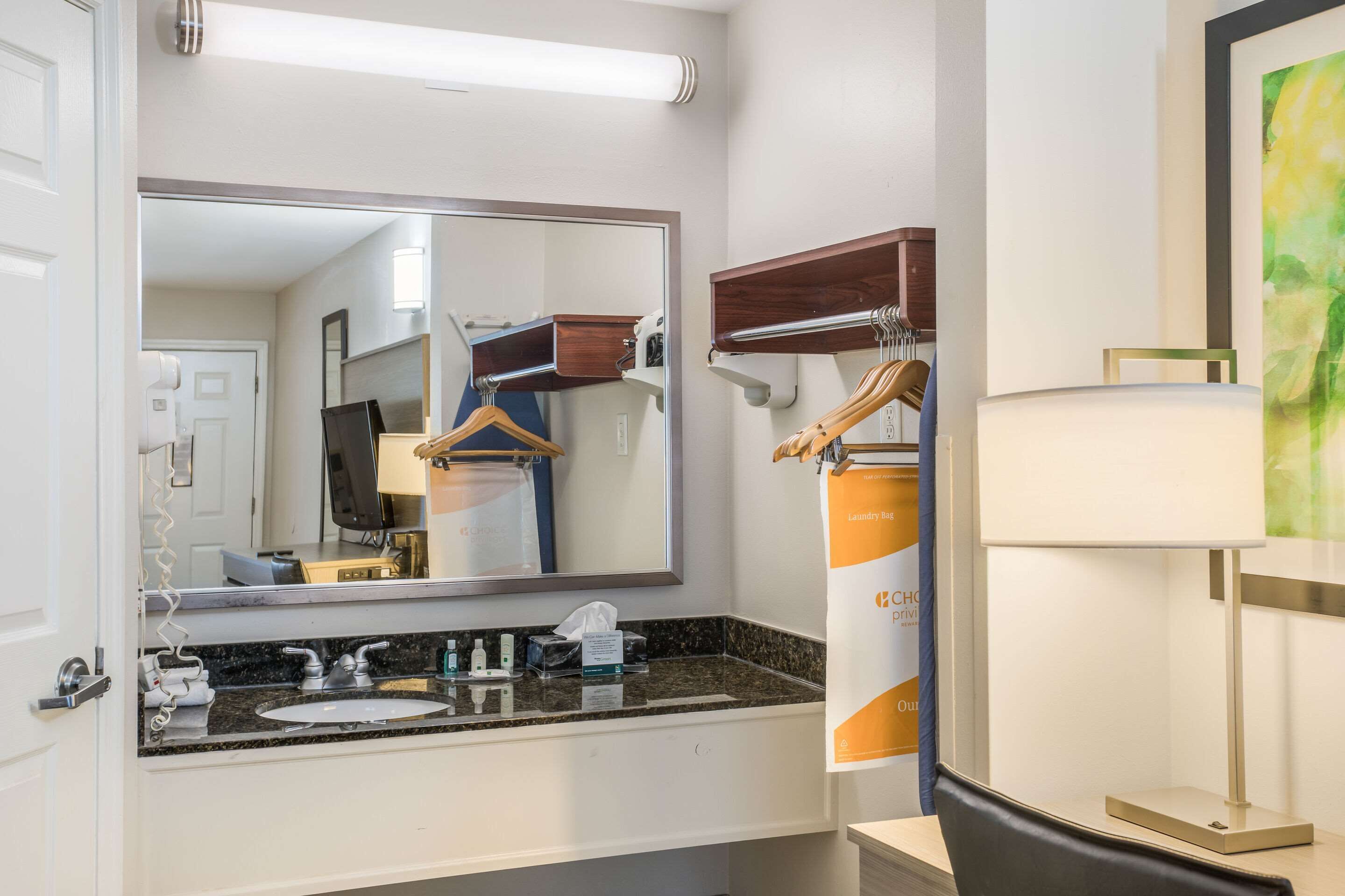 desk, laptop workspace, blackout curtains, iron/ironing board