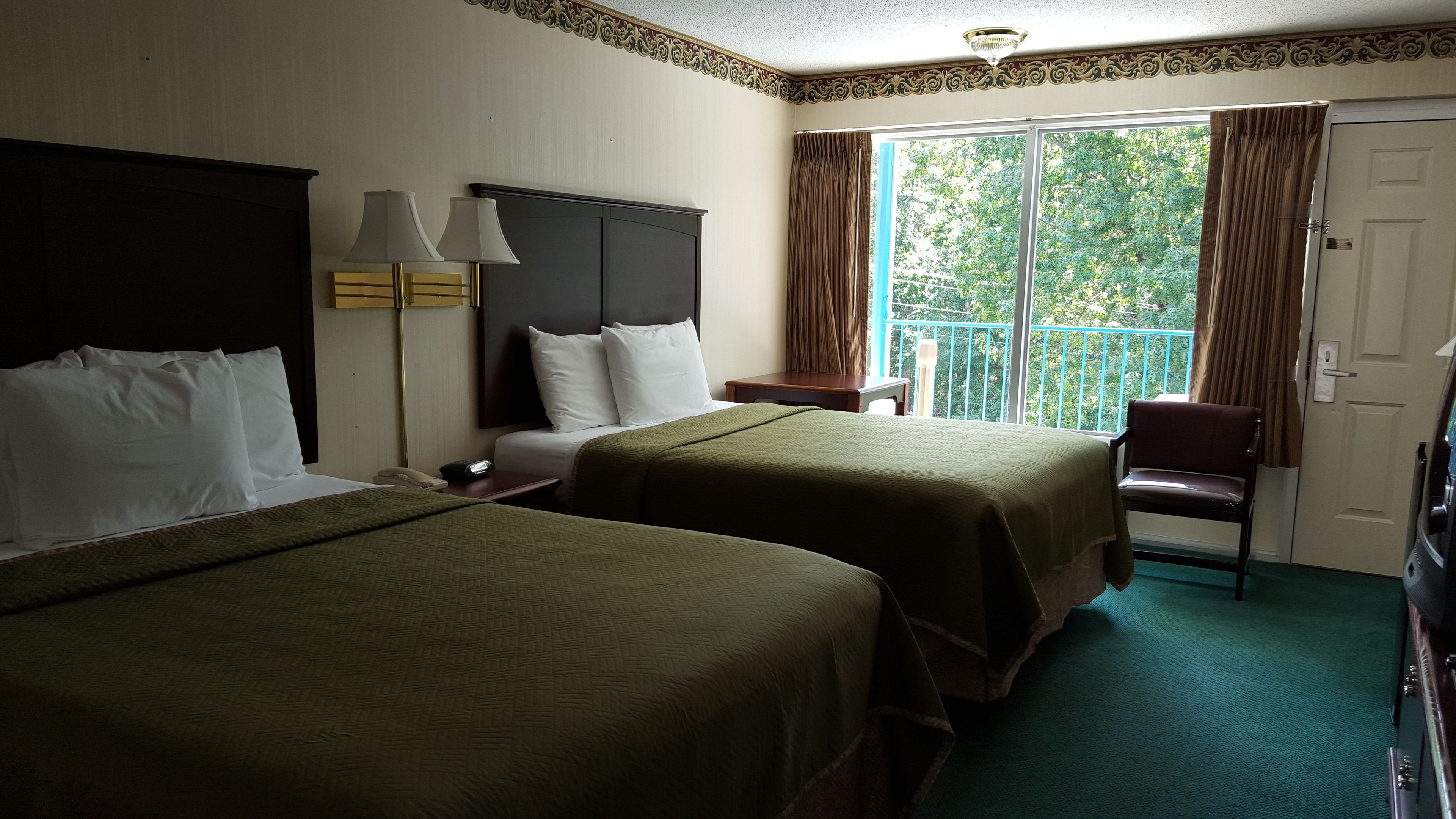 deluxe room, 2 queen beds | iron/ironing board, free wifi, bed sheets, alarm clocks