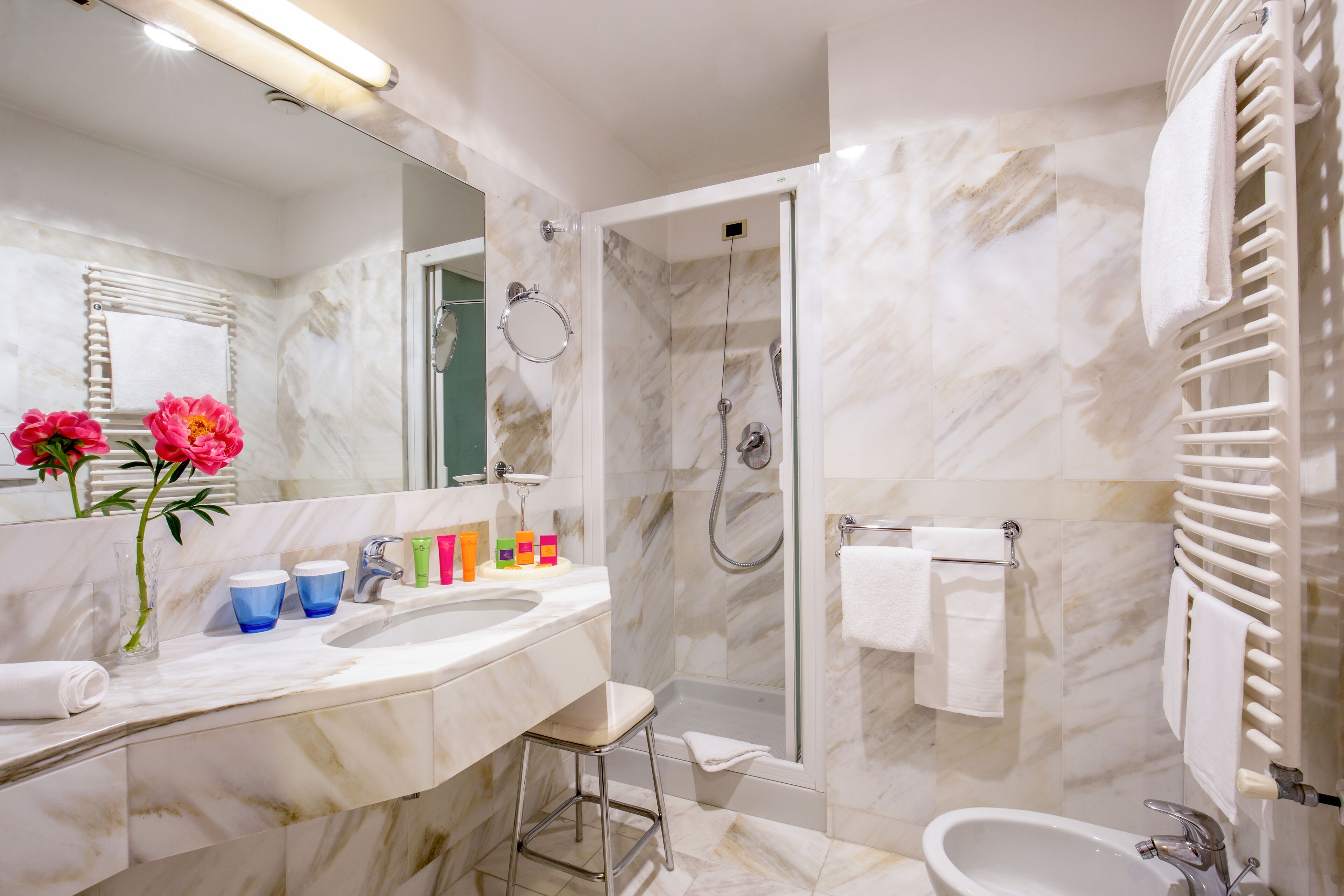 designer toiletries, hair dryer, bathrobes, slippers