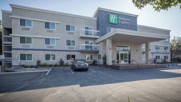 A Holiday Inn Express building with a parking lot in front.