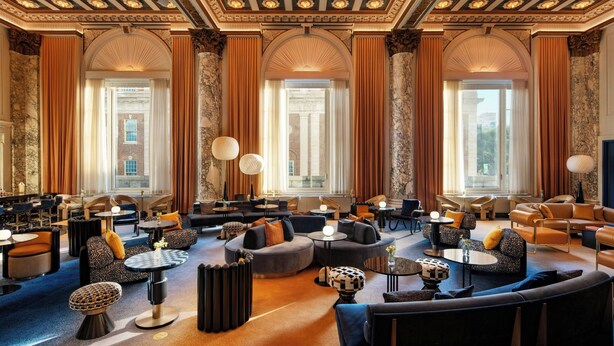 A luxurious lobby with high ceilings, ornate columns, and large windows. - W New York - Union Square (New York)