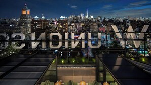 A rooftop bar with seating and a city skyline view. - W New York - Union Square (New York)