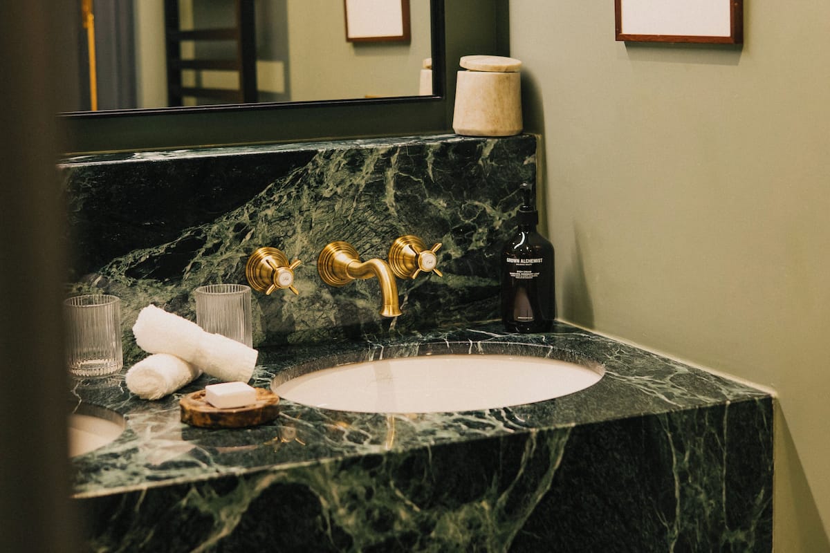 designer toiletries, hair dryer, bathrobes, slippers