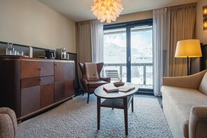 Junior Suite (Village View) | Minibar, in-room safe, iron/ironing board, free cribs/infant beds