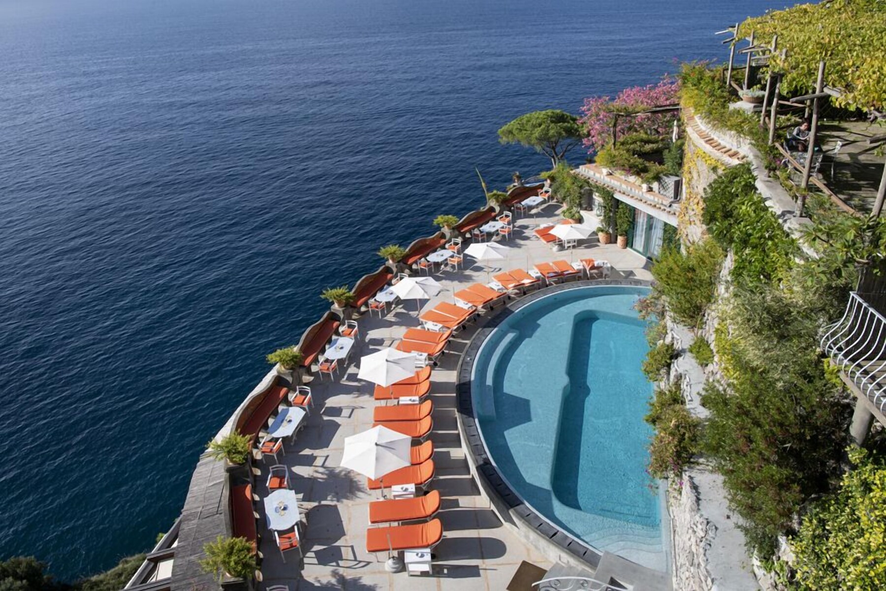 Outdoor pool, open 9:00 AM to 6:00 PM, pool umbrellas, pool loungers