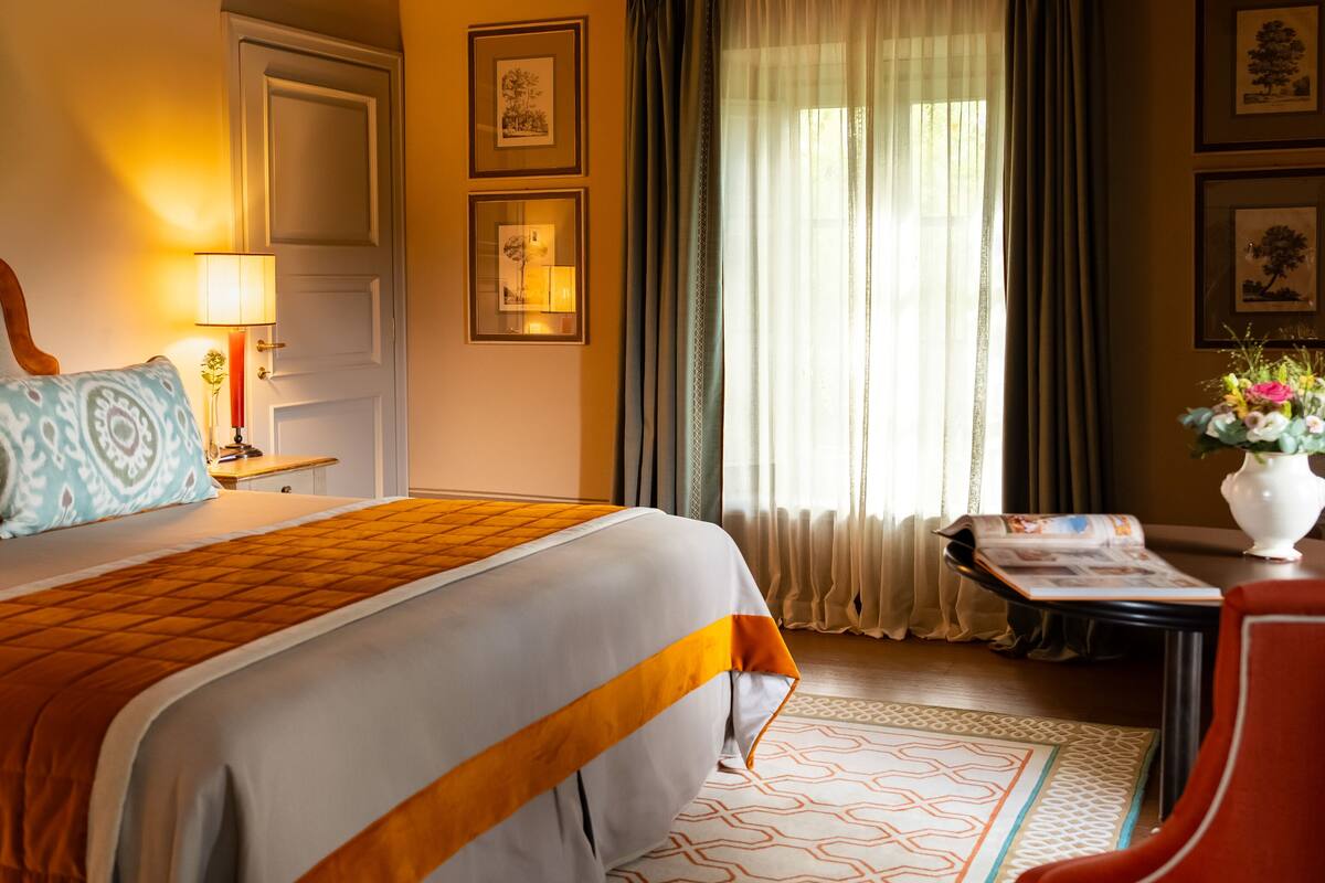 suite, garden view (colonica) | minibar, in-room safe, individually decorated, individually furnished