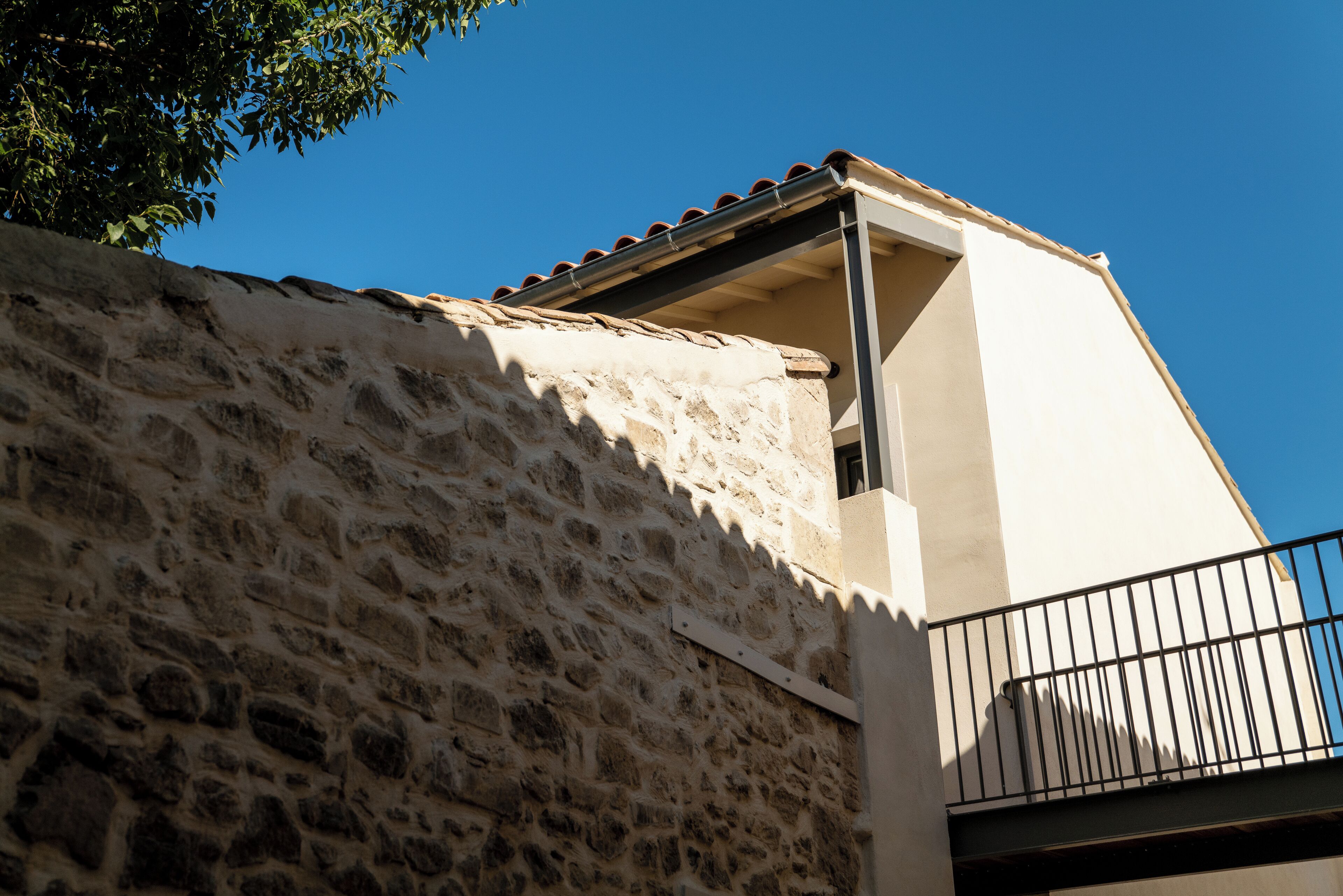 A stone building with a balcony.