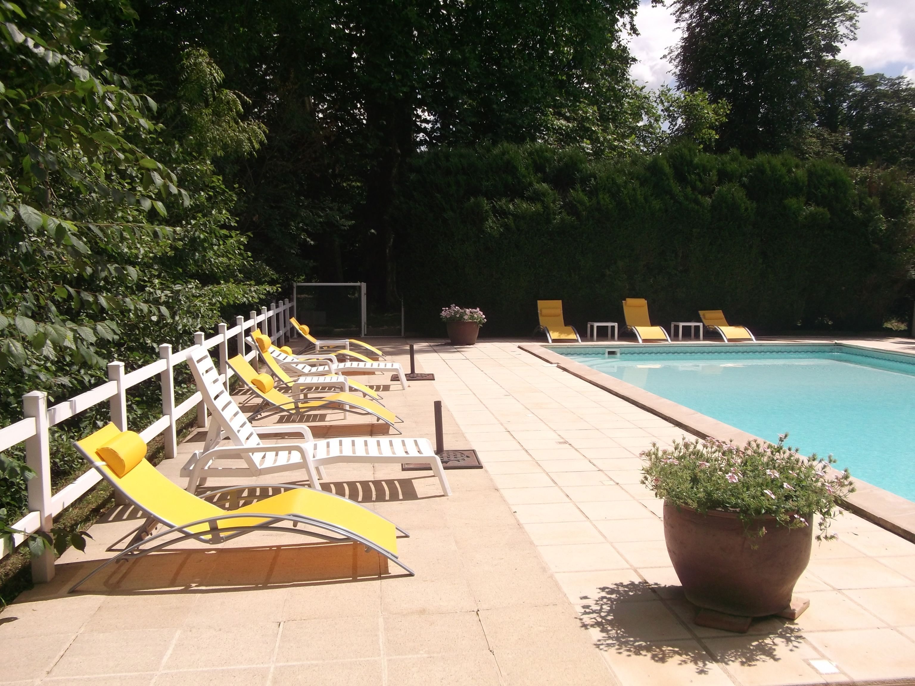 outdoor pool, pool umbrellas, pool loungers